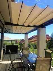 Backyard fabric retractable canopies on slide wire