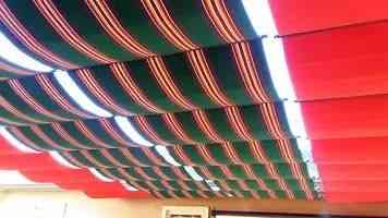 Red and green fabric shades on cables