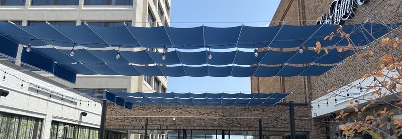 Long blue shade runners over commercial patio